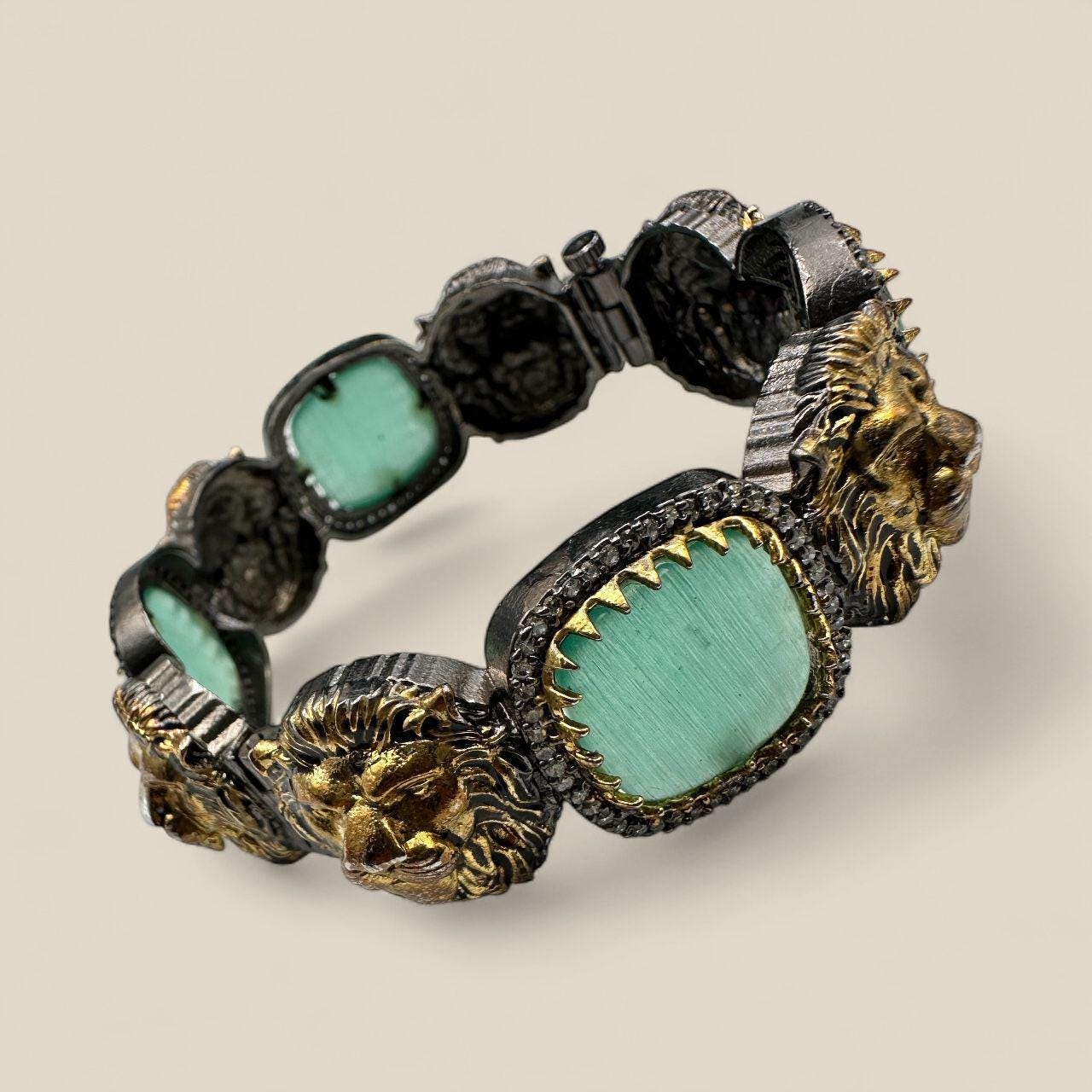 Sabya Openable Bangle Chunky | Lion Motif Gold & Silver with Mint Green Stones - Image 3